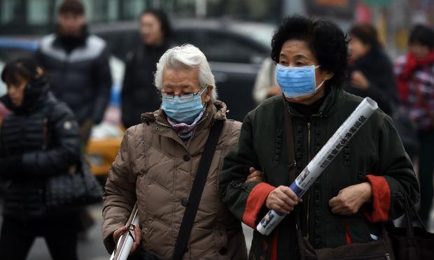 Visibilidade em algumas partes de Pequim recuará para menos de 500 metros na terça-feira / Foto: AFP